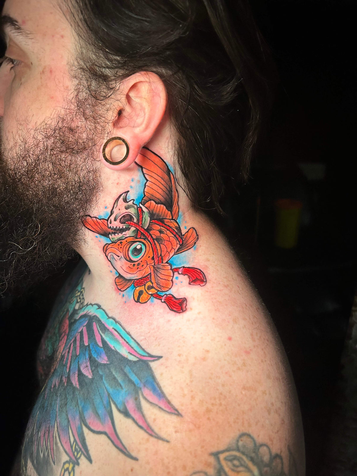 colour Neo traditional goldfish with skull tattoo on the neck
delboitattoos